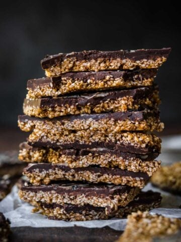 Front view of stacked pieces of chocolate sesame bark.