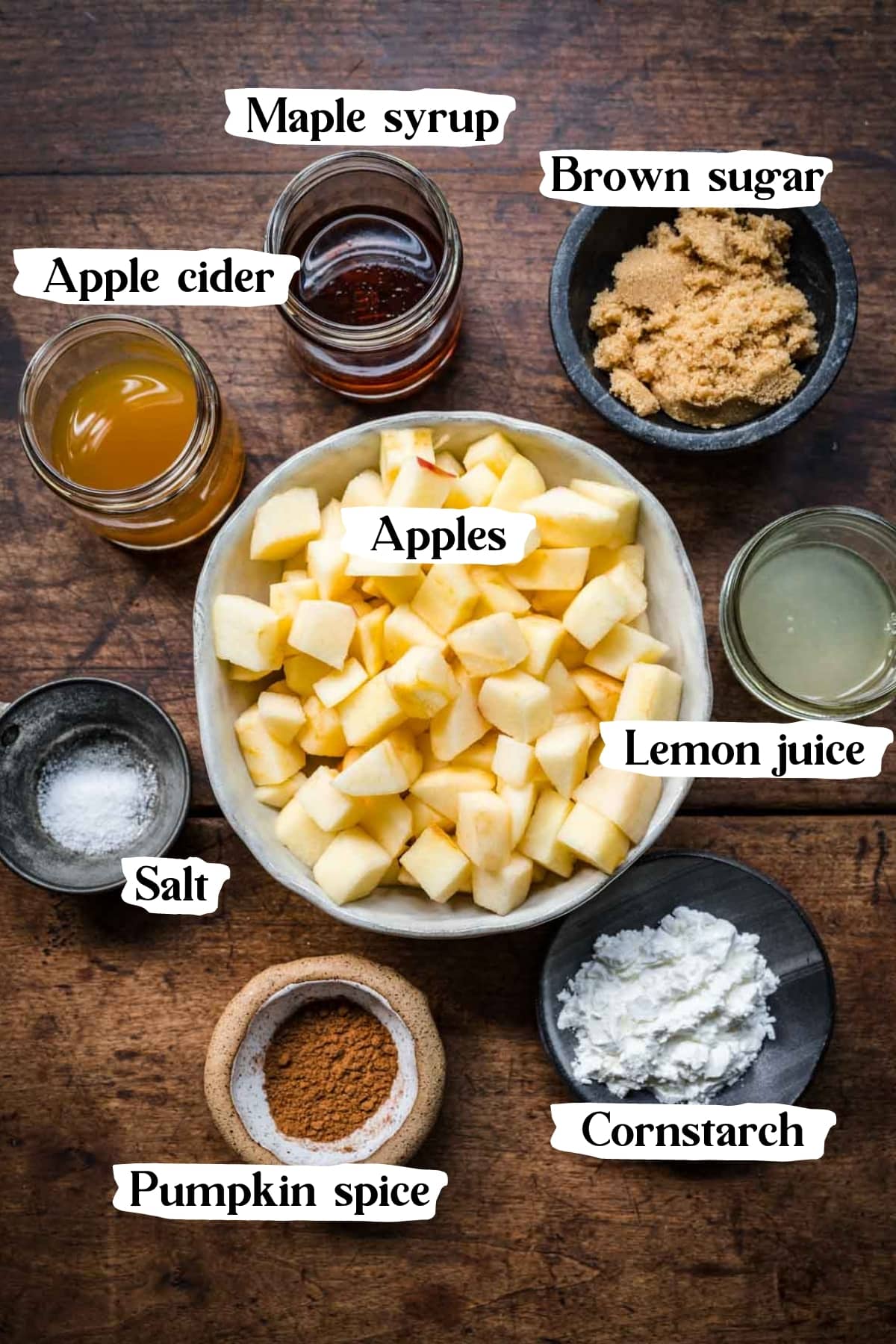 overhead view of ingredients for gluten free apple crisp filling in small prep bowls. 