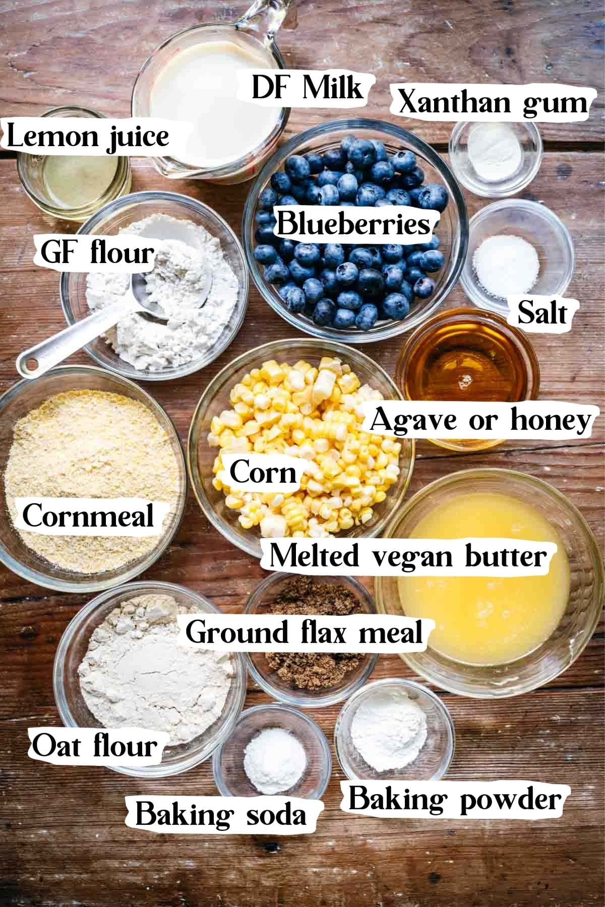 Overhead view of cornbread ingredients in small bowls.