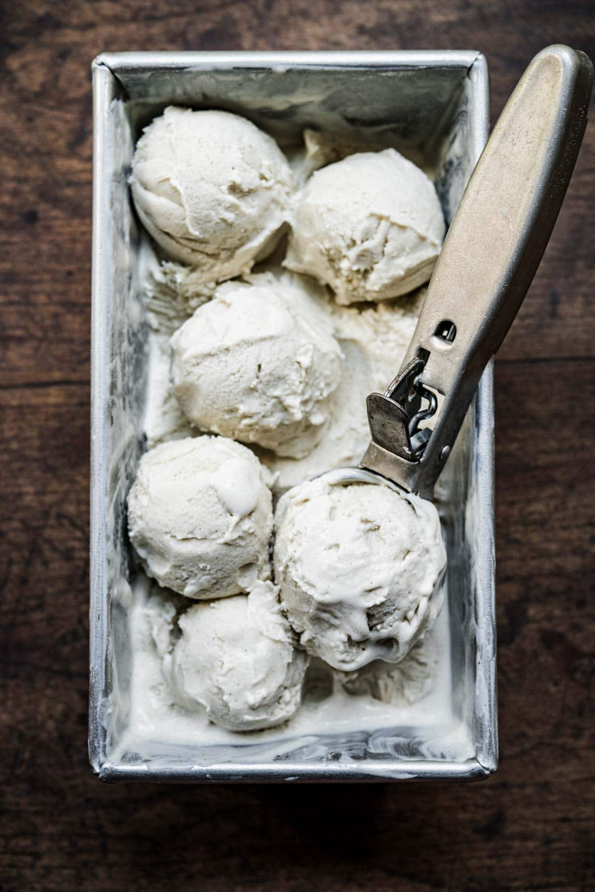 overhead view of vegan no churn vanilla ice cream in scoops. 