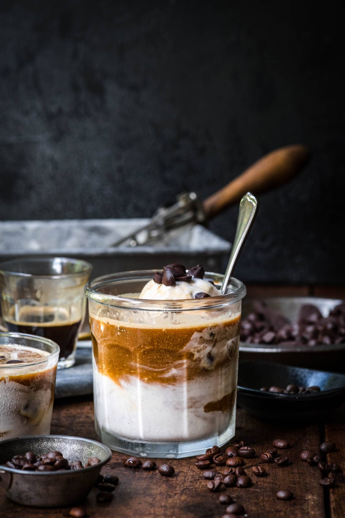 Front view of affogato in a glass jar with coffee beans as garnish.