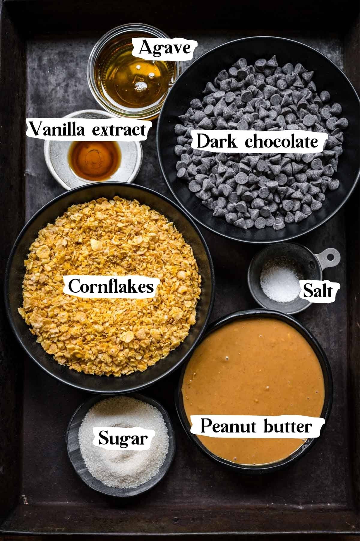 Overhead view of all vegan butterfinger ingredients, including chocolate and cornflakes.