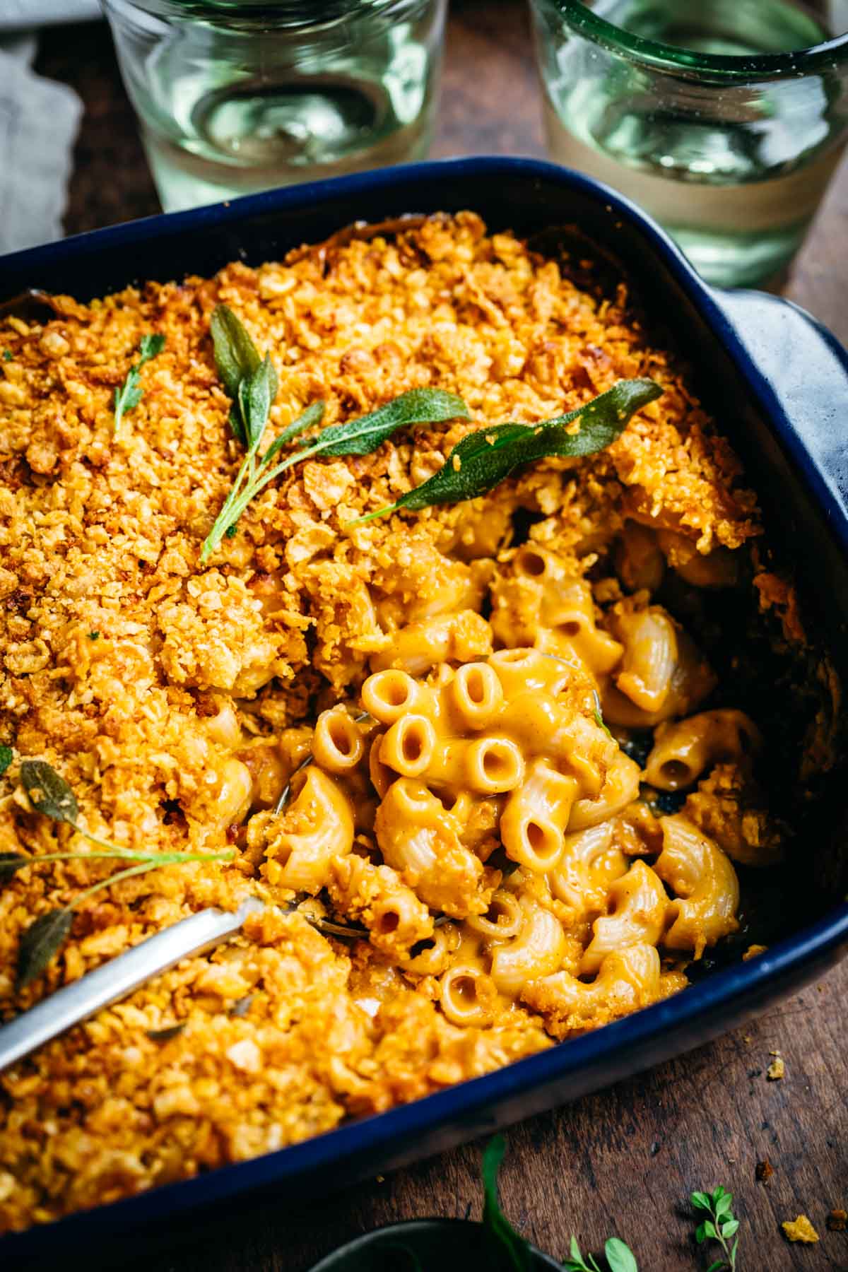 Overhead view of macaroni and cheese in a blue baking dish.