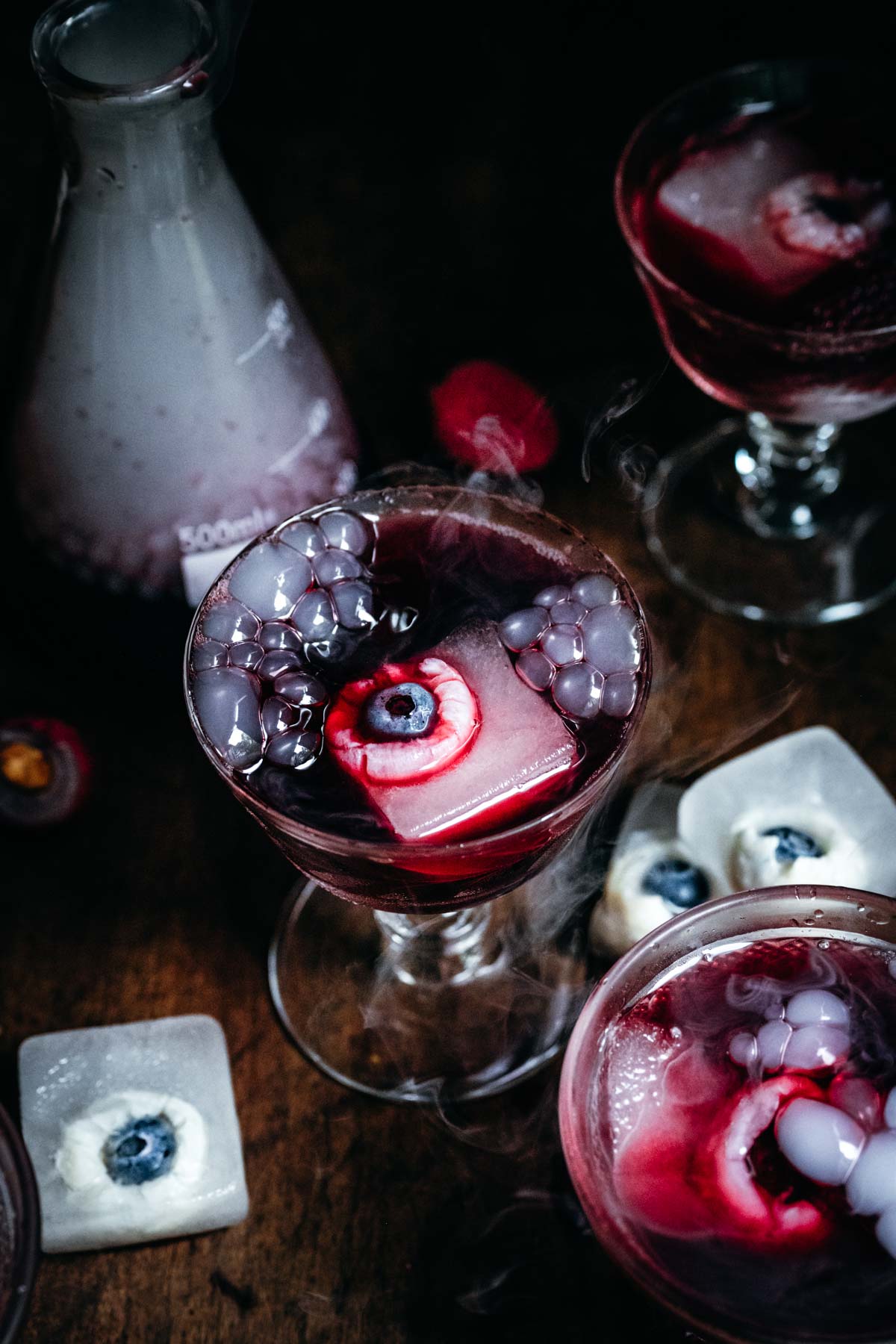 Overhead view of cocktail with dry ice and bubbles.