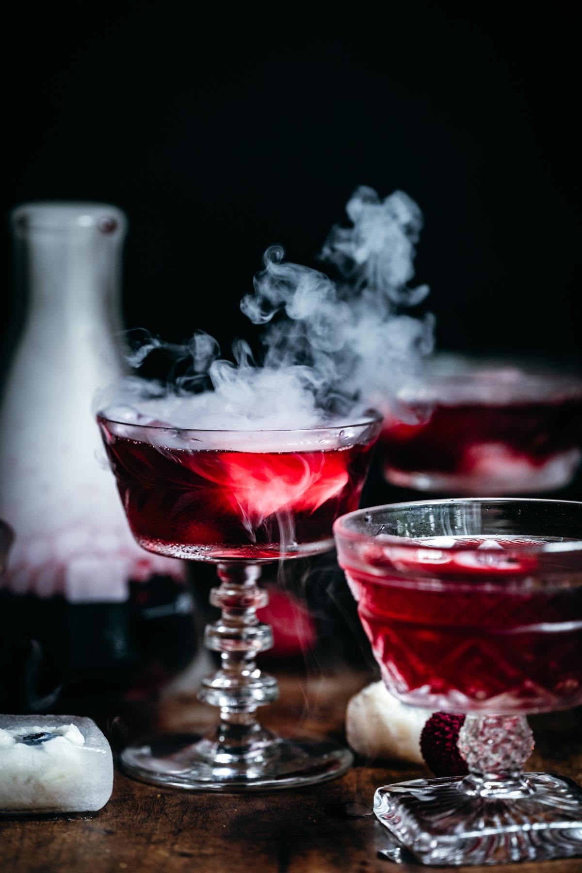 Front view of cocktail with dry ice coming off the surface.