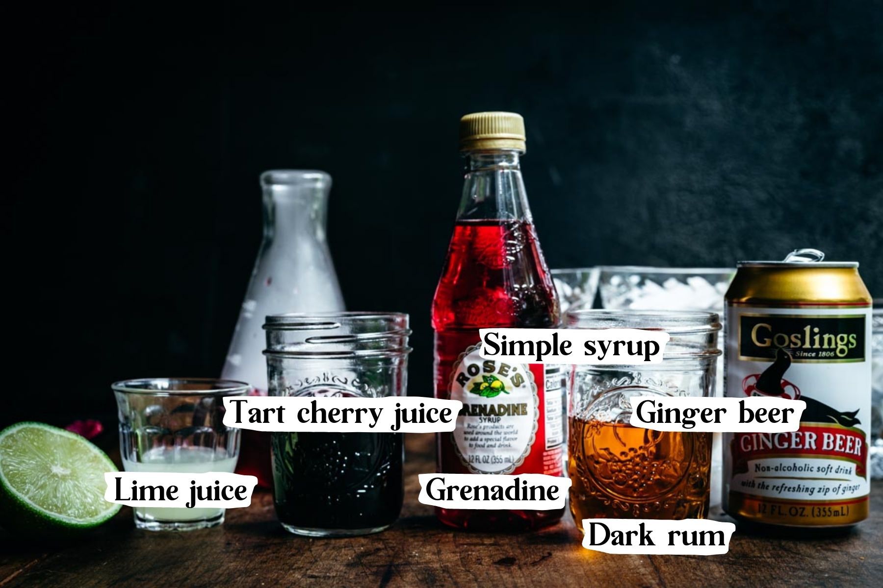 Front view of cocktail ingredients, including grenadine and tart cherry juice.