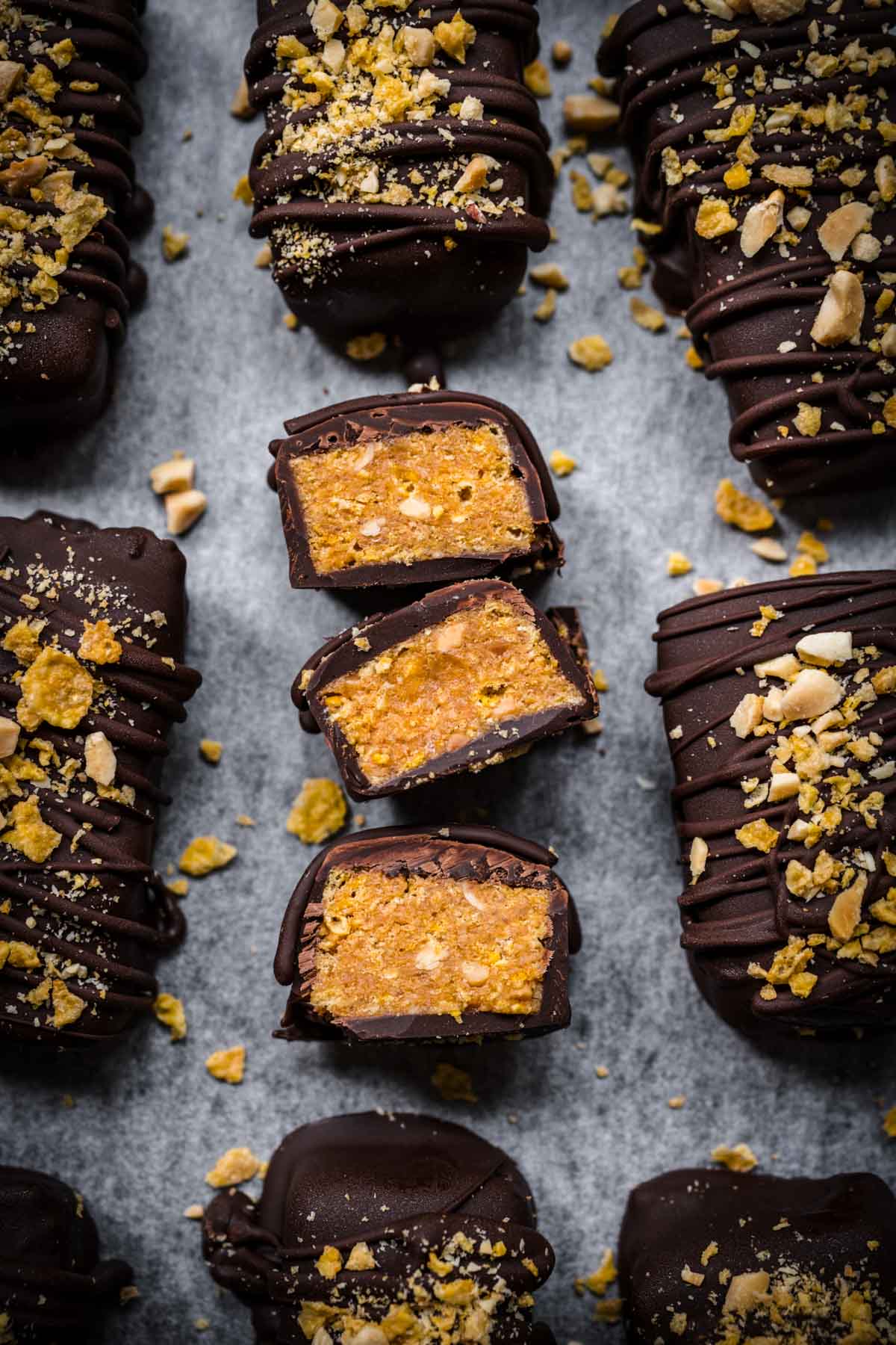 Overhead view of butterfingers on a lined parchment tray.