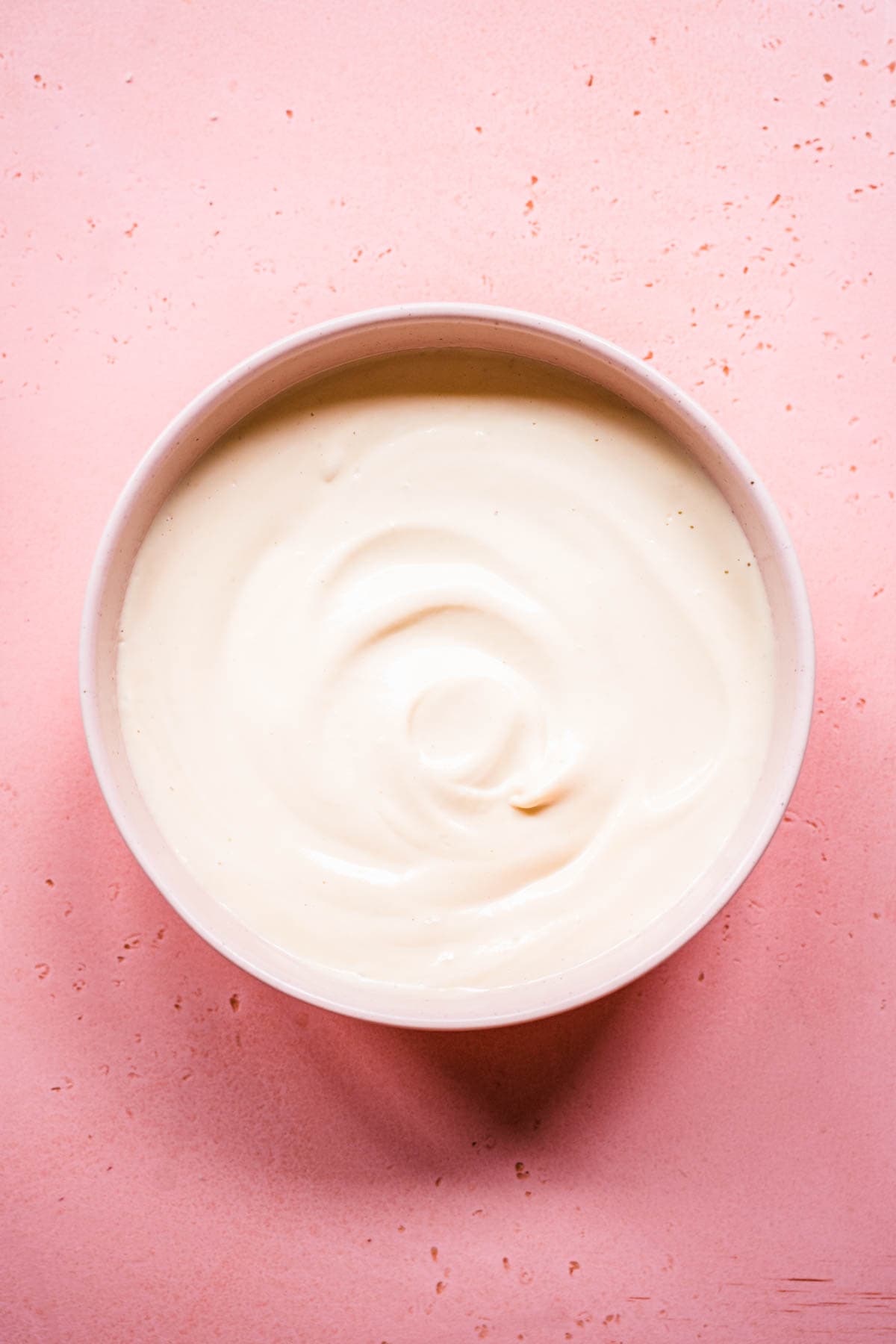 close up view of vegan sour cream in a bowl.