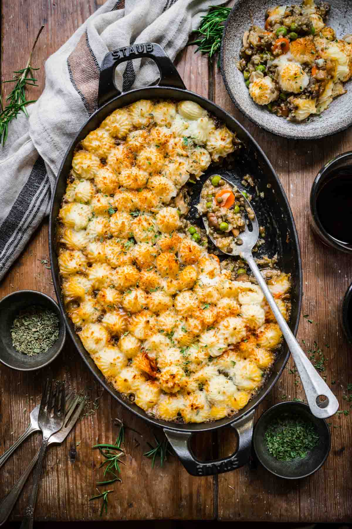 Overhead view of shepherd's pie with mashed potatoes and a scoop taken out.