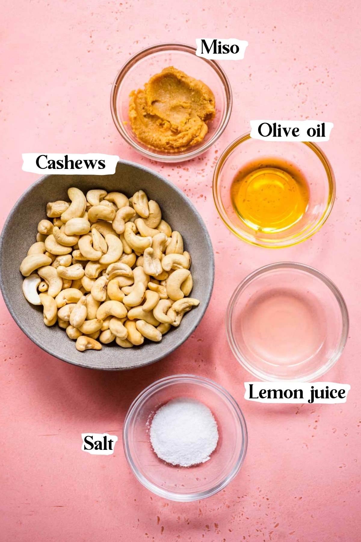 overhead view of ingredients for vegan sour cream in small bowls. 