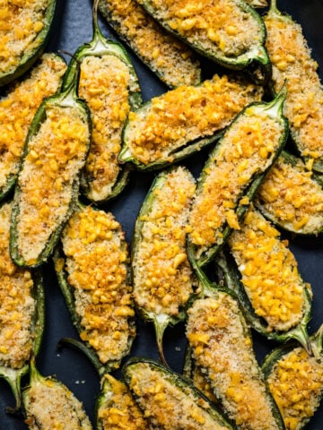 Overhead view of jalapeno poppers on a sheet pan.
