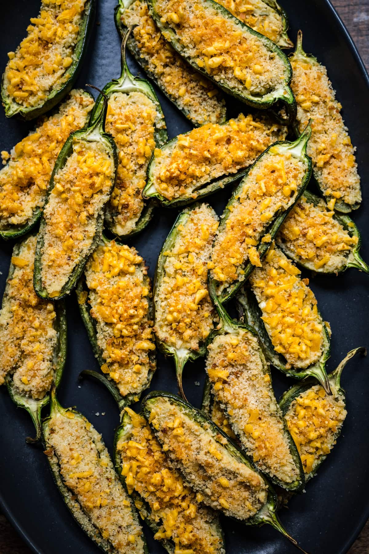 Overhead view of jalapeño poppers on a sheet pan.