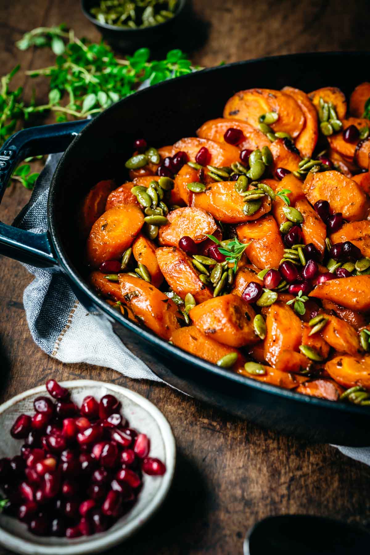 Close up view of maple glazed carrots in a pan.