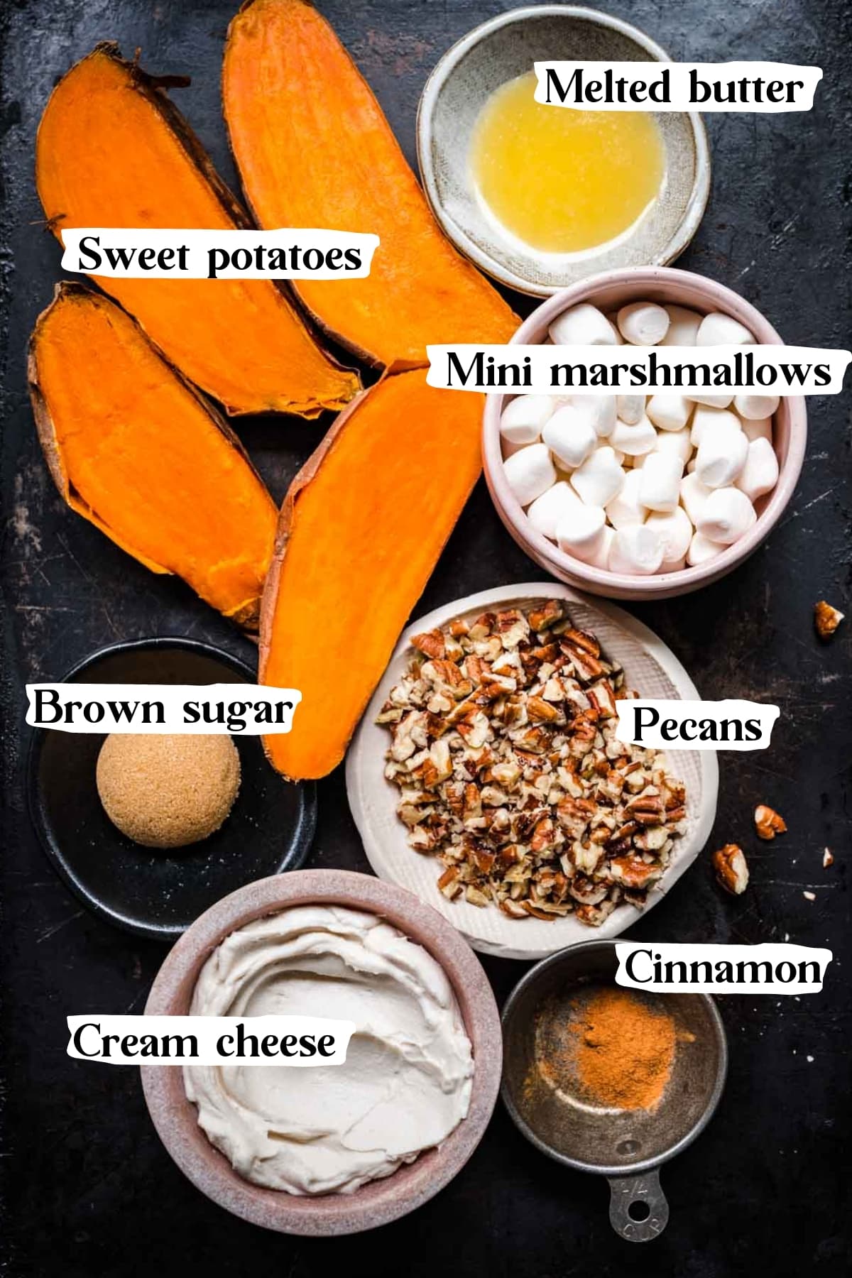 overhead view of ingredients for twice baked sweet potatoes with marshmallows on sheet pan. 
