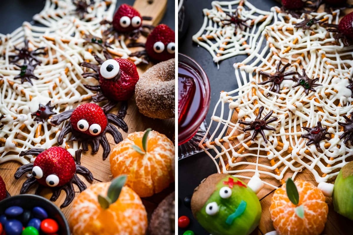 Strawberry chocolate spiders and pretzel white chocolate spider webs on Halloween charcuterie board. 