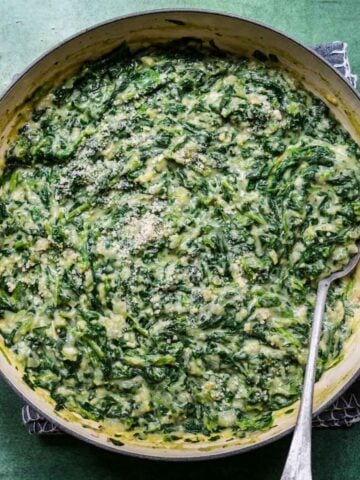 Close up of vegan creamed spinach in a bowl.