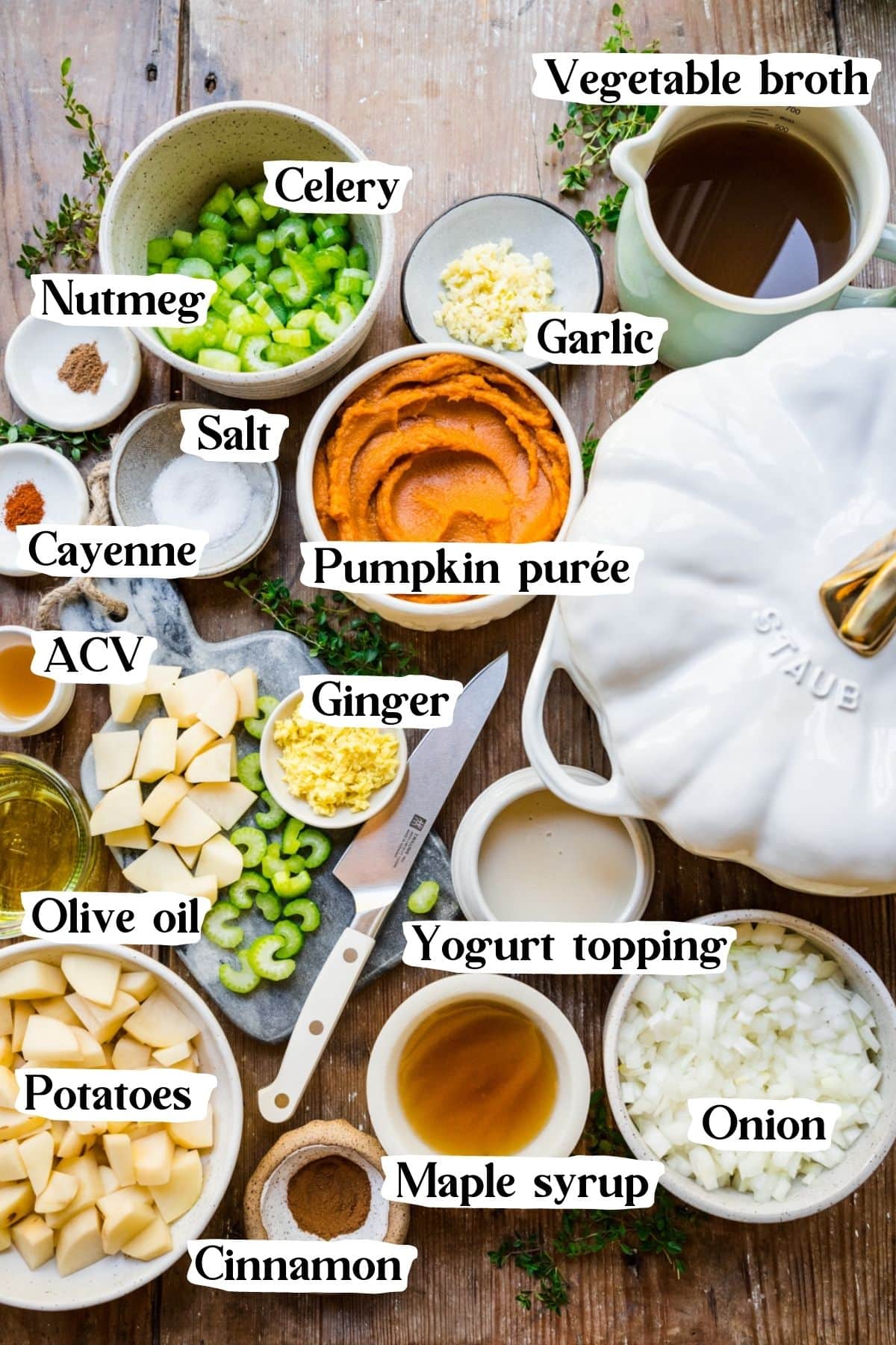 Overhead shot of pumpkin soup ingredients, including pumpkin puree, potatoes, ginger, and garlic.