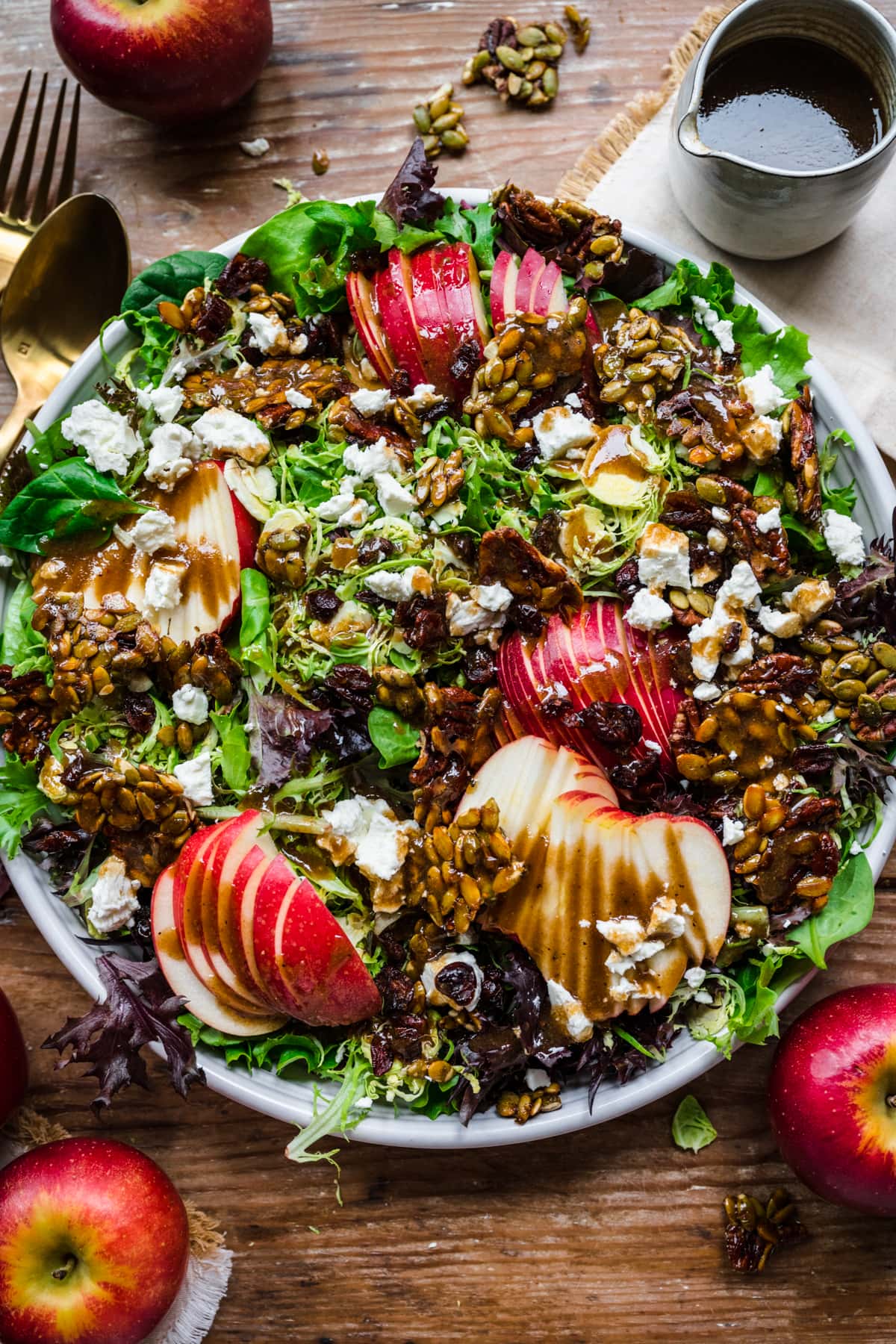 Overhead view of salad topped with balsamic dressing.