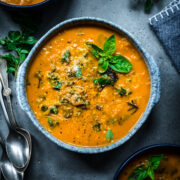 Overhead view of spaghetti squash soup in a bowl.