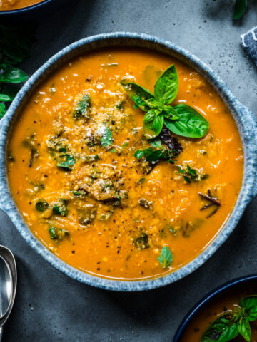 Overhead view of spaghetti squash soup in a bowl.