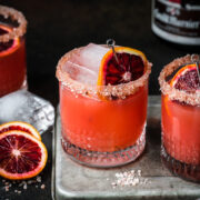 Front view of a grand marnier margarita garnished with a blood orange slice.