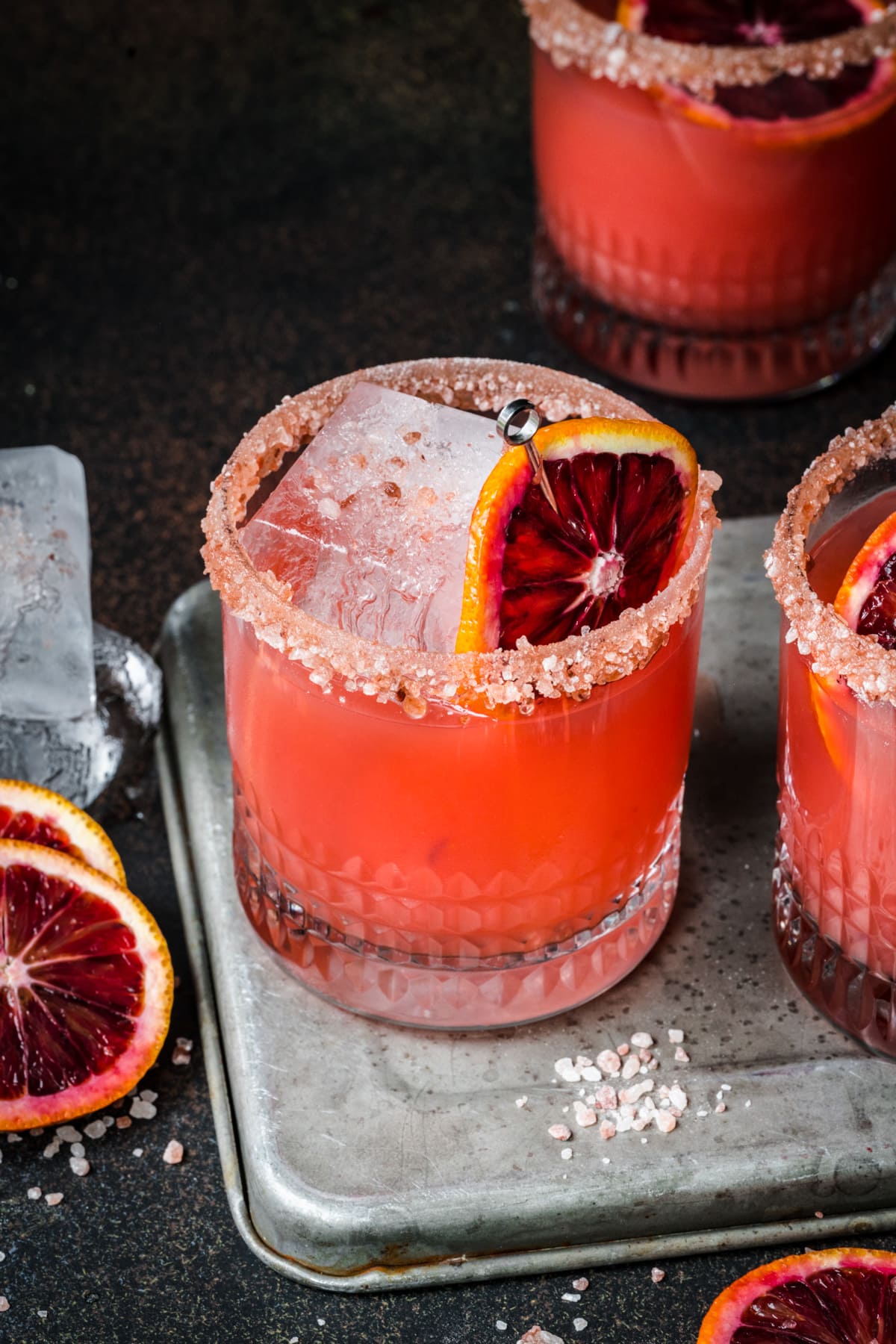 Front view of grand marnier margarita set atop a metal tray.