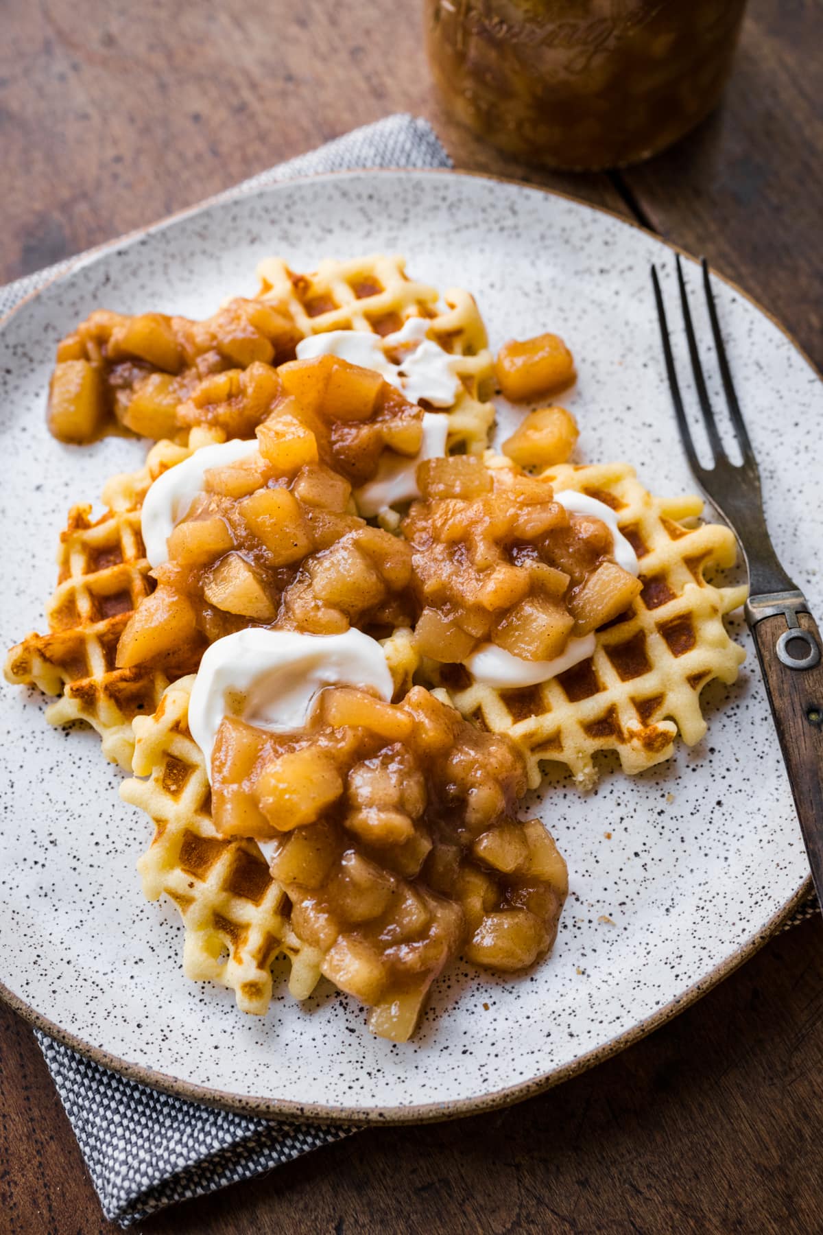 Pear compote and yogurt on waffles. 