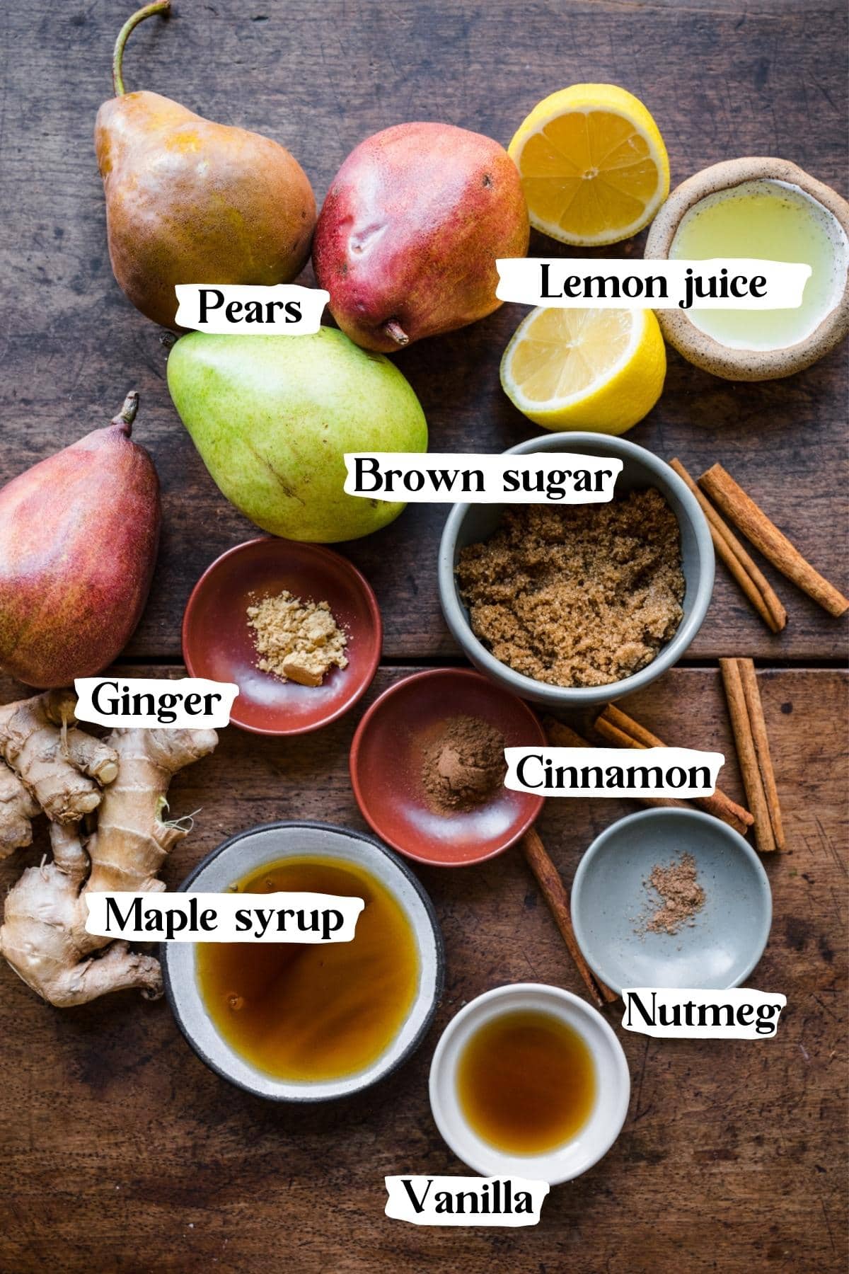 overhead view of ingredients for pear compote in small bowls. 