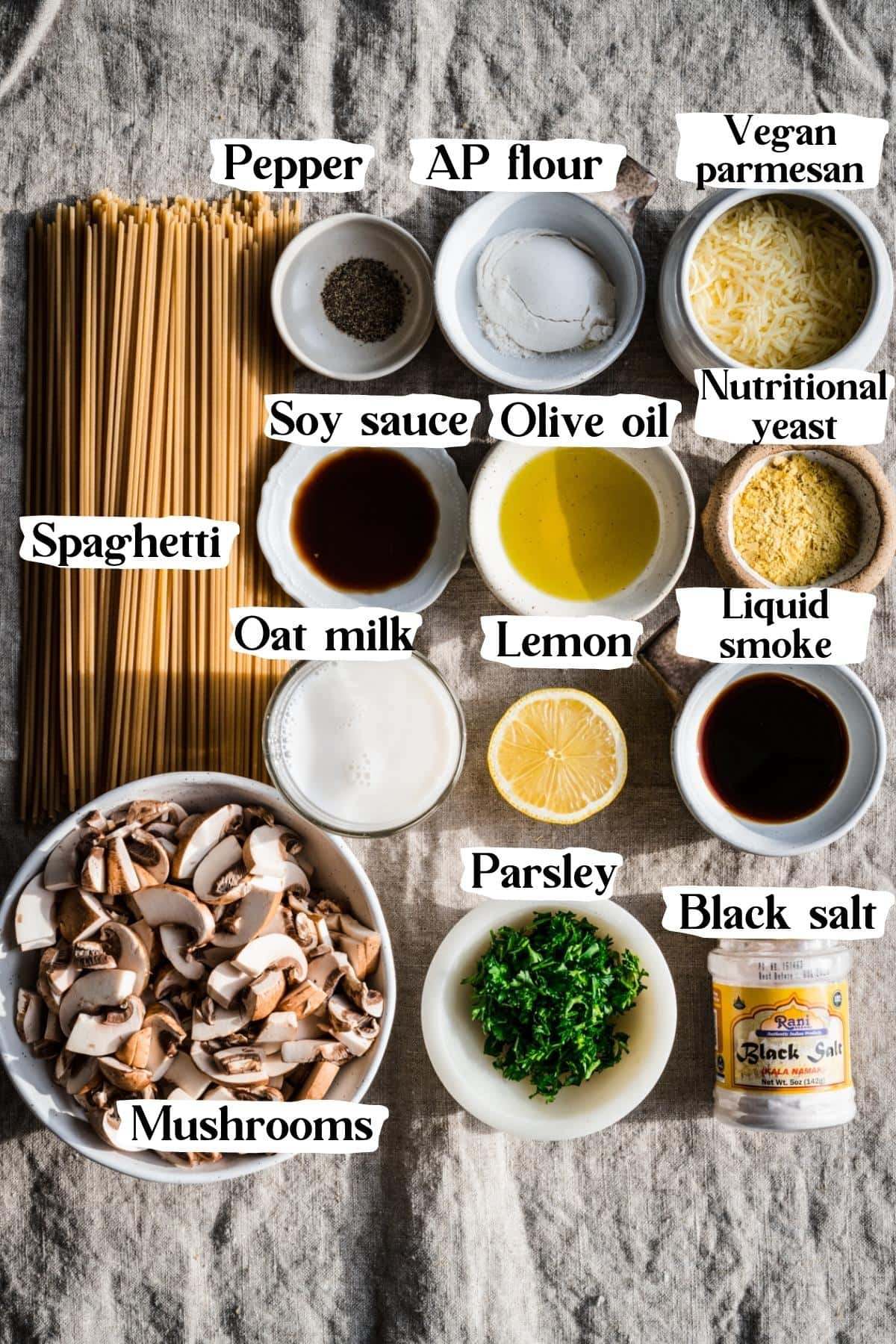 overhead view of ingredients for vegan carbonara in small prep bowls. 