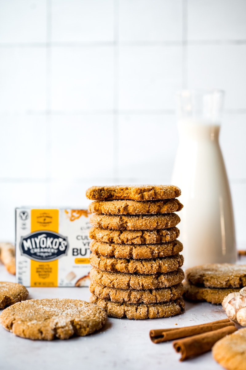 Front view of vegan ginger cookies stacked on top of each other.