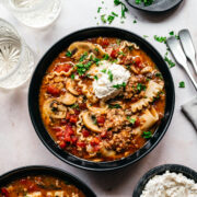 Overhead view of vegan lasagna soup in a bowl.