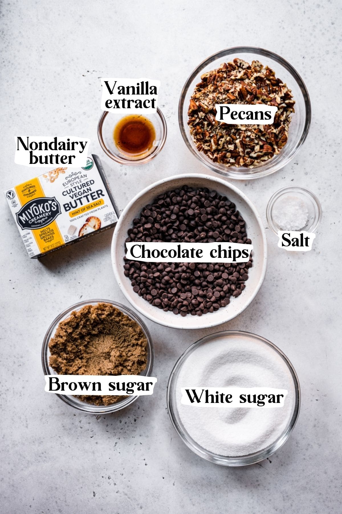 Overhead view of vegan toffee ingredients, including chocolate chips and nondairy butter.