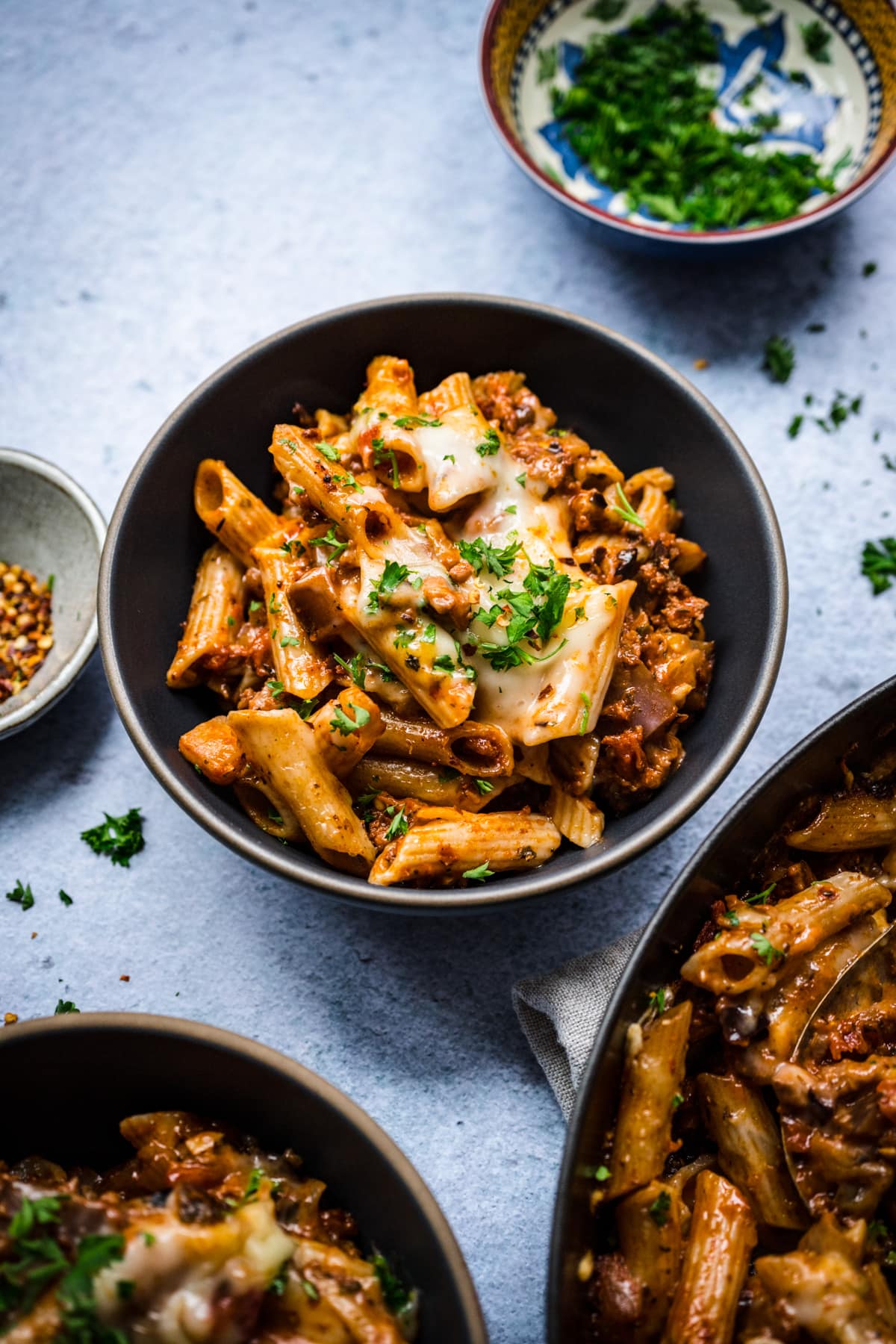 pasta al forno in a bowl with fresh parsley. 