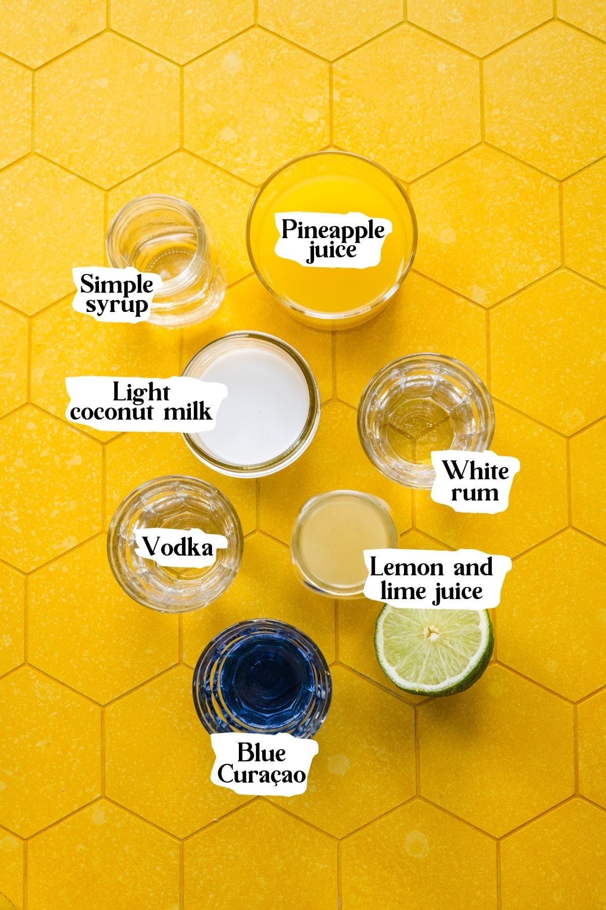 Overhead view of blue hawaiian cocktail ingredients.