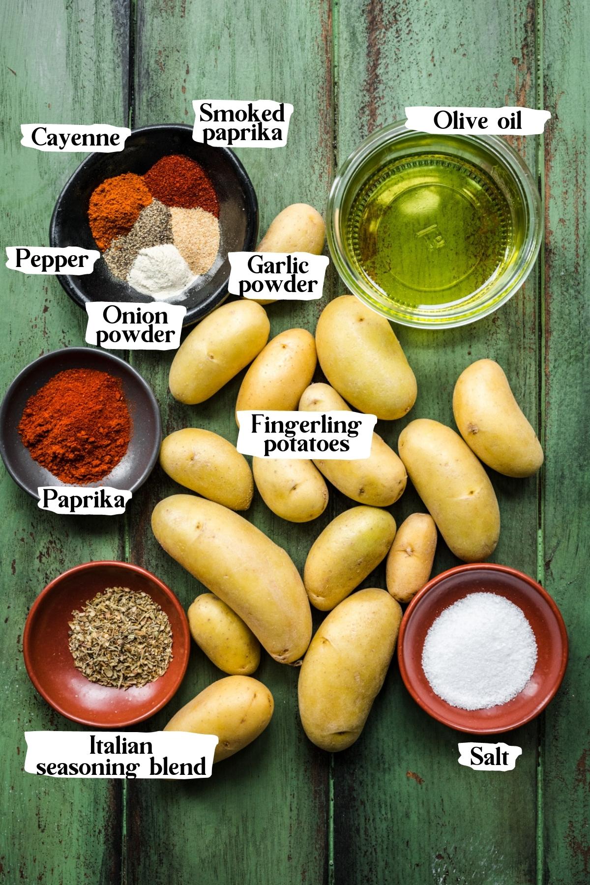 Overhead view of cajun potatoes ingredients, including fingerling potatoes, seasoning, and oil.
