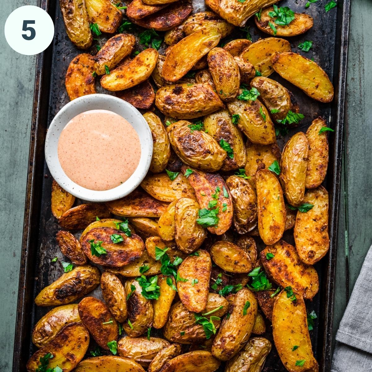 Overhead view of finished potatoes on a pan.