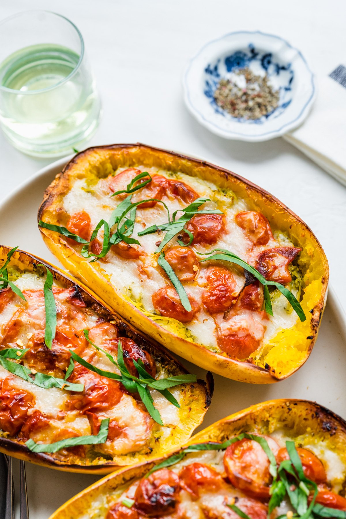 Close up view of pesto caprese spaghetti squash.