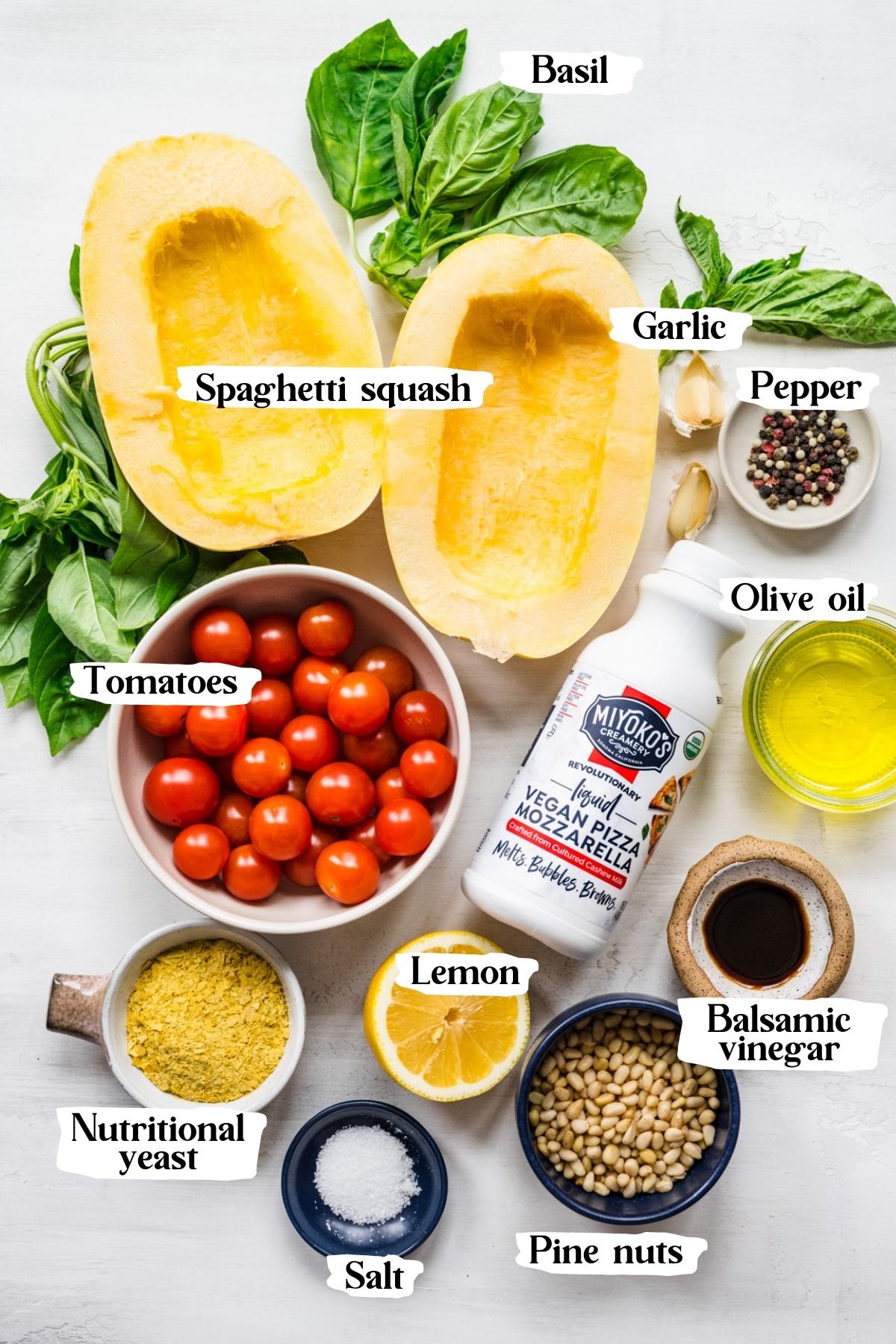 overhead view of ingredients for caprese spaghetti squash in prep bowls. 