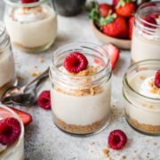 Overhead view of raspberry cheesecake in a jar.