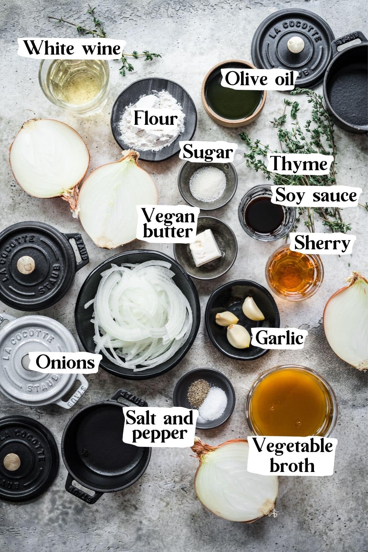 Overhead view of french onion soup ingredients, including onions and vegetable broth.