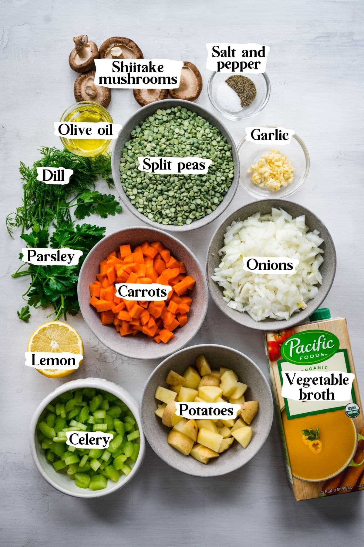 Overhead view of split pea soup ingredients, including split peas, onions, and carrots.