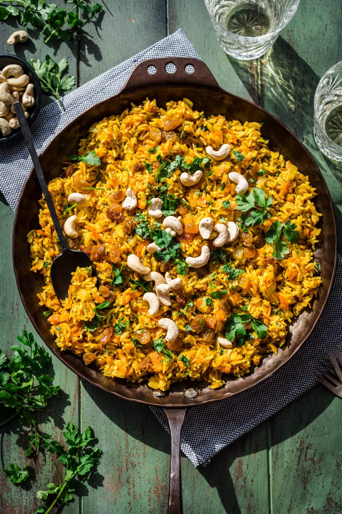 Overhead view of carrot rice in a pan.