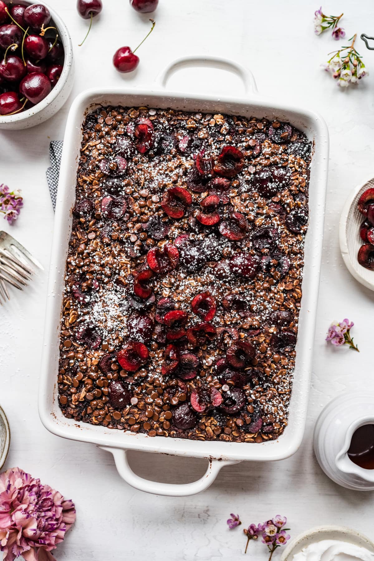 Overhead view of chocolate cherry baked oats in a pan.