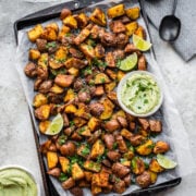 Overhead view of mexican potatoes on a sheet pan.