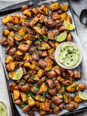Overhead view of mexican potatoes on a sheet pan.