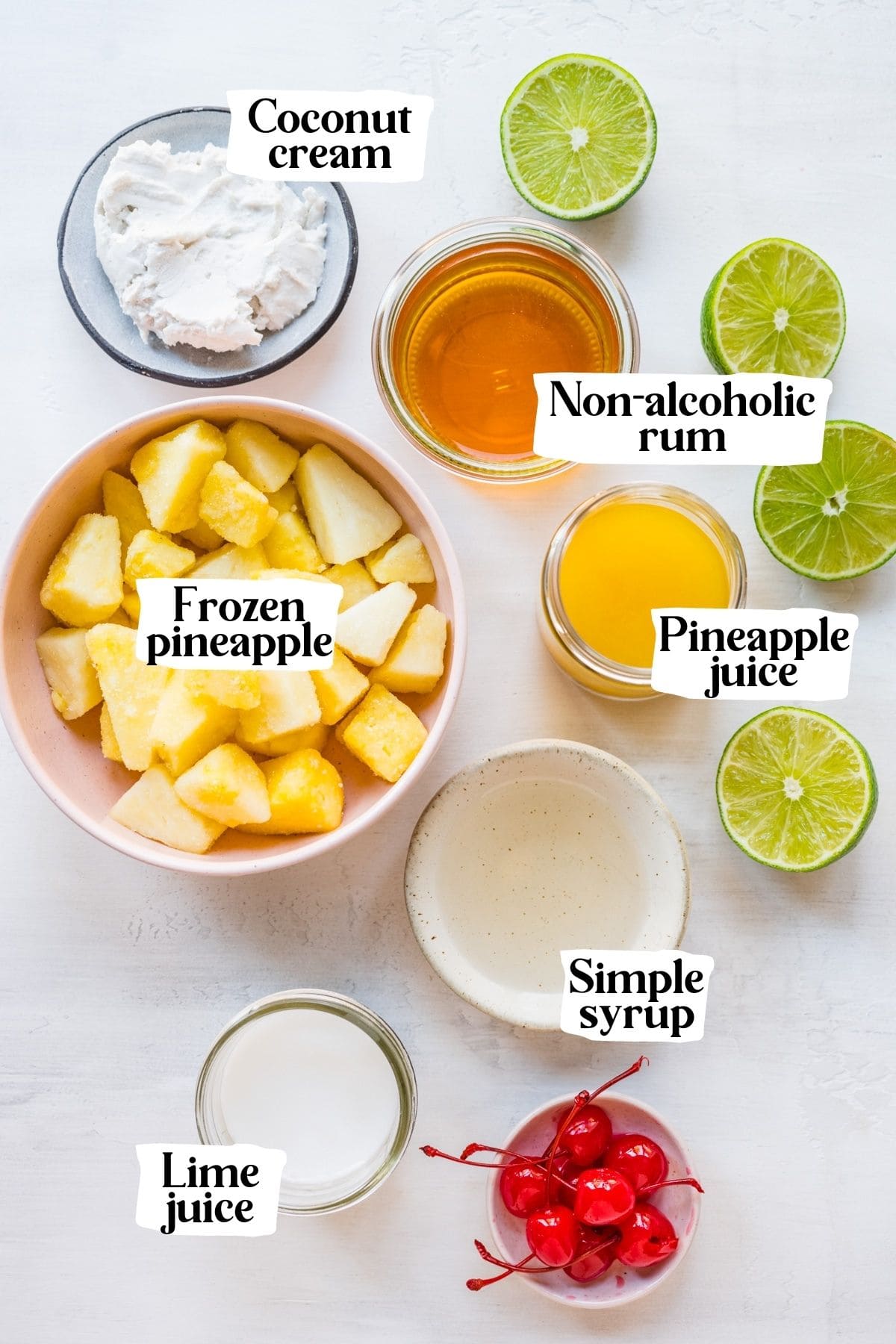 Overhead view of piña colada mocktail ingredients, including frozen pineapple and cream of coconut.