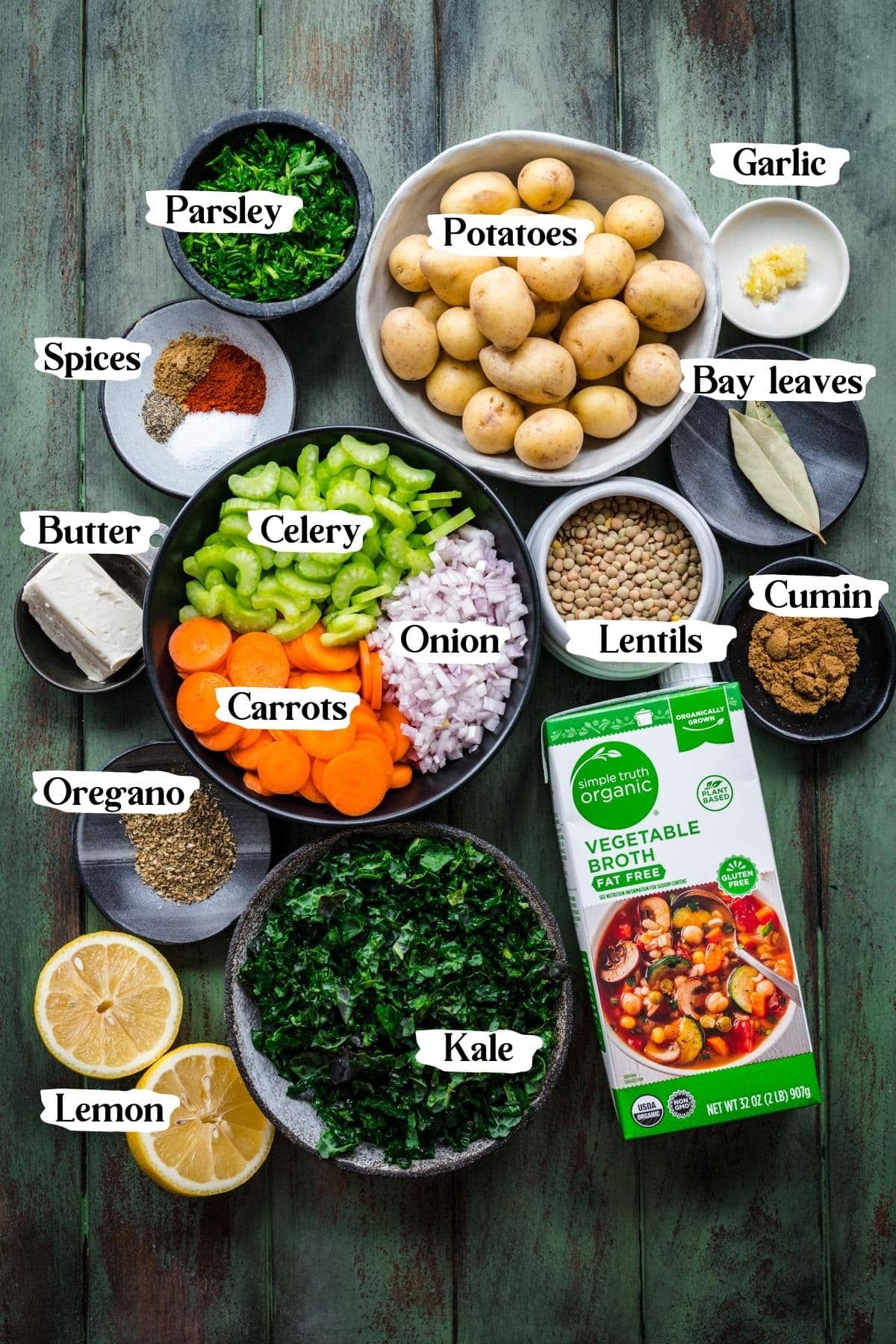 Overhead view of ingredients for potato lentil soup in small prep bowls. 