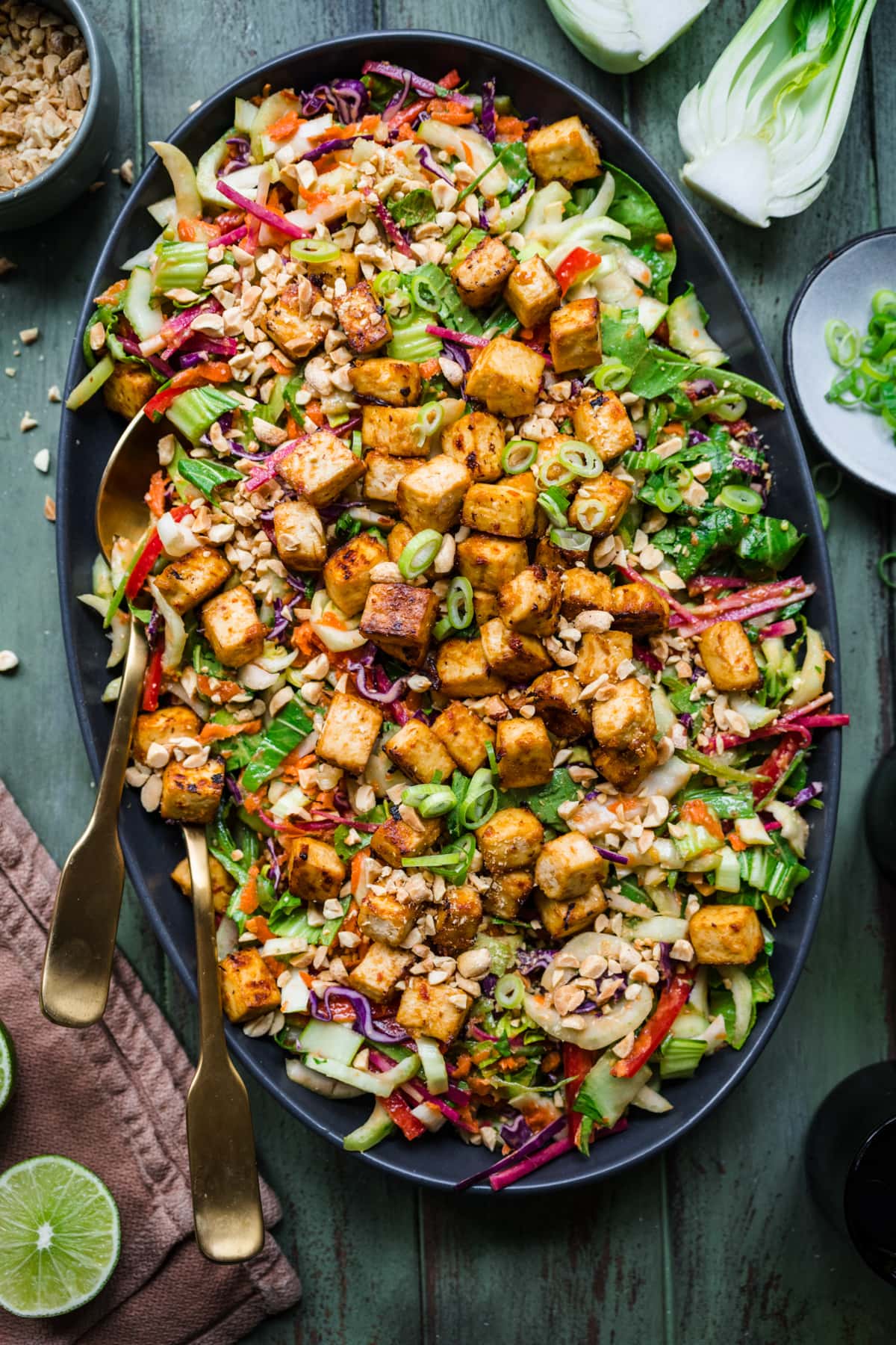 Overhead view of thai vegetable and tofu salad on a platter. 