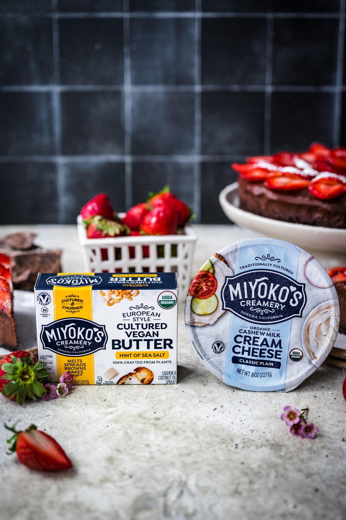 side view of Miyoko's butter and cream cheese in packaging. 