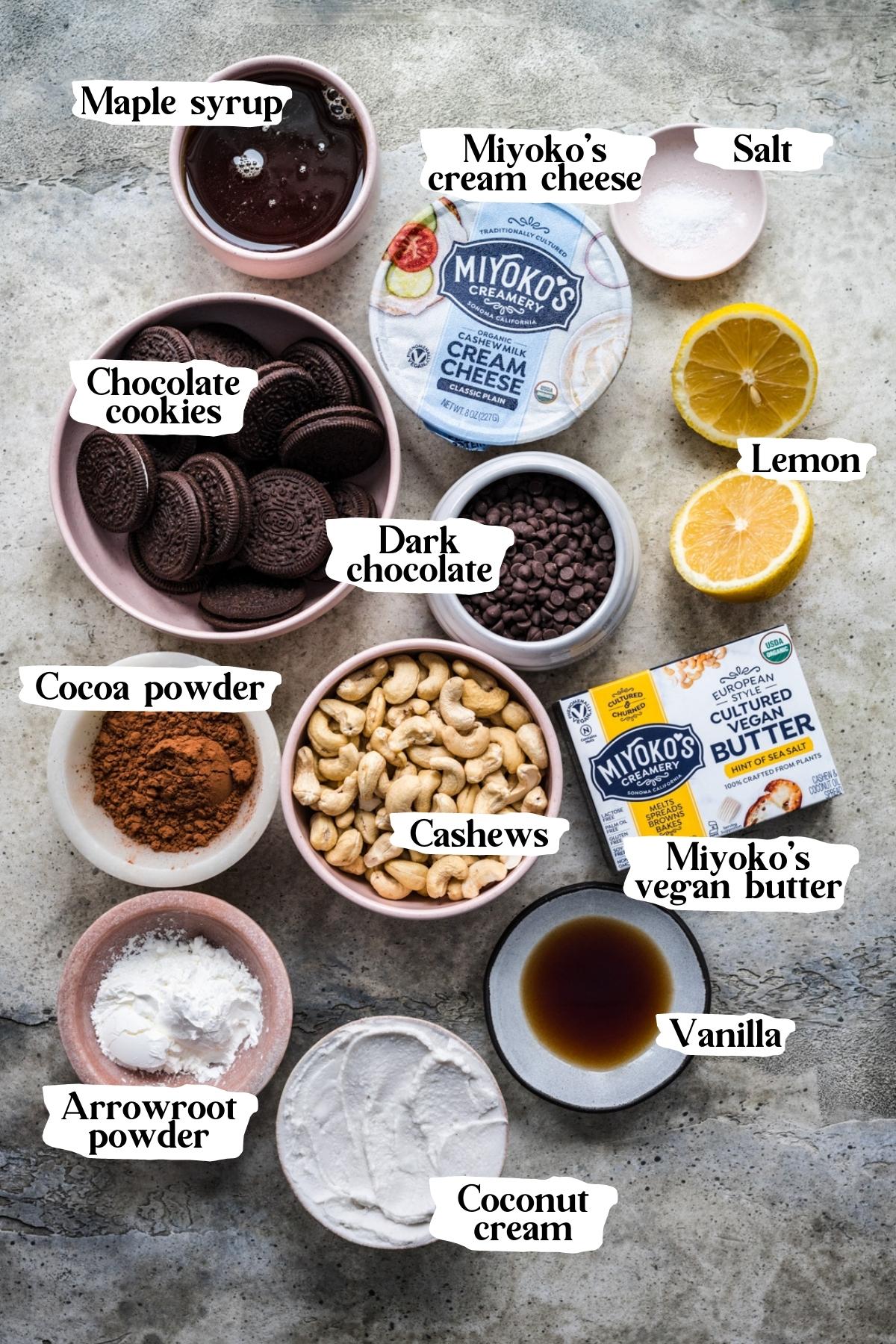 overhead view of ingredients for vegan chocolate cheesecake in small prep bowls. 